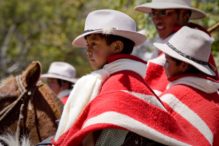 PICHINCHA, ECUADOR - OCTOBER 10, 2010: Unknown local indigenous boys celebrating local festivities in Pintagのeditorial素材