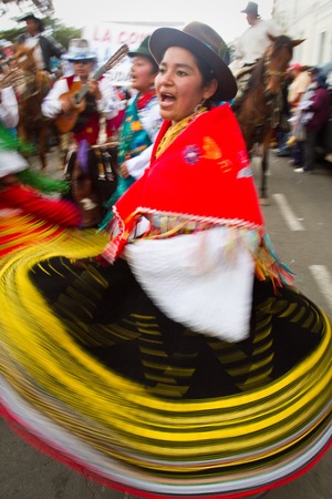 PICHINCHA, ECUADOR - JUNE 30, 2011: Unidentified beautiful indigenous dancer with elaborate costume at Inti Raymi celebration in Cayambe, Ecuadorのeditorial素材