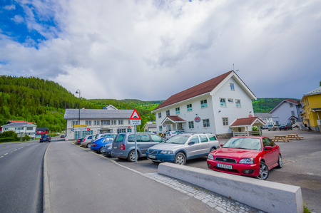 VALDRES, NORWAY - 6 JULY, 2015: Charming small town of Fagernes with small city buildings sorrounded by green mountains.のeditorial素材