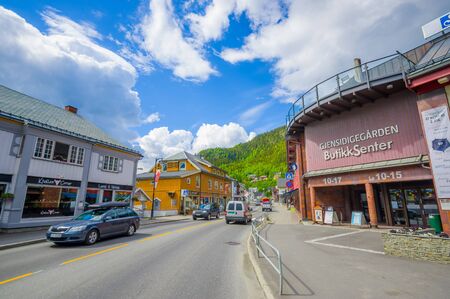 VALDRES, NORWAY - 6 JULY, 2015: Charming small town of Fagernes with small city buildings sorrounded by green mountains.のeditorial素材