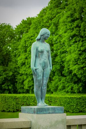 OSLO, NORWAY - 8 JULY, 2015: Various nude sculptures in different positions as part of famous Vigelandsparken on a beautiful summer day.のeditorial素材