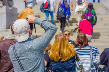 OSLO, NORWAY - 8 JULY, 2015: Tourists enjoying a beautiful sunny day in the famous Vigelandsparken which contains numerous nude sculptures.のeditorial素材
