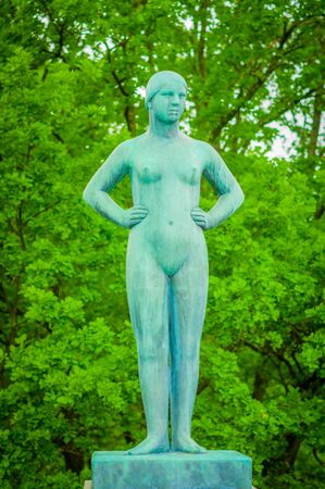 OSLO, NORWAY - 8 JULY, 2015: Various nude sculptures in different positions as part of famous Vigelandsparken on a beautiful summer day.のeditorial素材