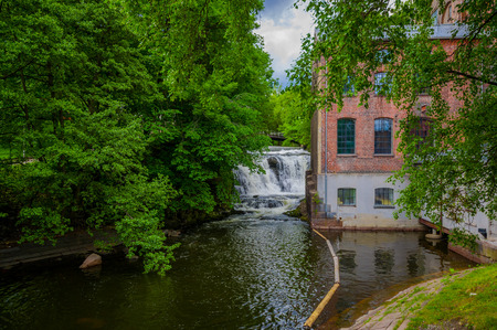 OSLO, NORWAY - 8 JULY, 2015: Alongside Akerselva river passing through city with charming pathways and houses.のeditorial素材