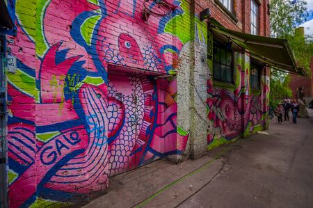 OSLO, NORWAY - 8 JULY, 2015: Graffiti street art on the walls of buildings in popular artistic area Brenneriveien at Grunerlokka.のeditorial素材