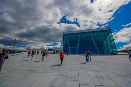 OSLO, NORWAY - 8 JULY, 2015: Walking on the spectacular opera house building located waterfront eastside of city with beautiful architecture and views.のeditorial素材