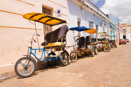 CAMAGUEY, CUBA - SEPTEMBER 4, 2015: bicitaxi, a modified bicycle used for transportation of tourists and goods as a taxi.のeditorial素材