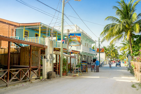 CAYE CAULKER, BELIZE - APRIL 10, 2014: Touristic street with hostels and restaurants in Caye Caulker, caribbean townのeditorial素材