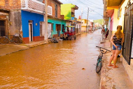 TRINIDAD, CUBA - SEPTEMBER 8, 2015: Flooded streets in the Cuban city of Trinidad a perfectly preserved Spanish colonial settlement.のeditorial素材