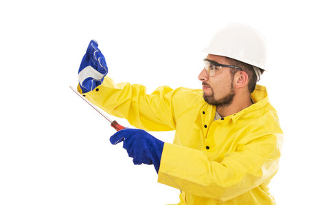 man with screwdriver in yellow water protective suit