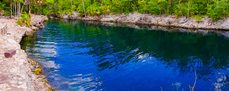 BAY OF PIGS, CUBA - SEPTEMBER 9, 2015:  Tourist attraction for swimming in Cueva de los Peces,  seaside cave with tropical fish.のeditorial素材
