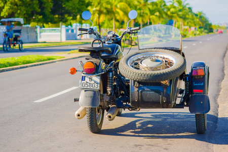 CIENFUEGOS, CUBA - SEPTEMBER 12, 2015: Classic motorcycle with sidecar are still in use and old...