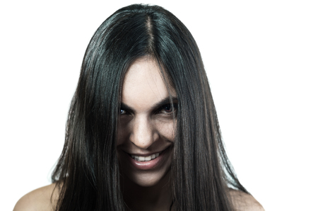 Beautiful young brunette girl with abundant hair isolated on whiteの写真素材