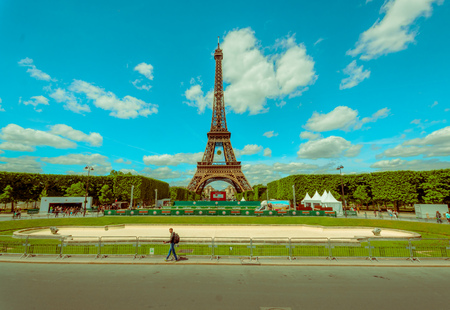 PARIS, FRANCE - JUNE 1, 2015: Beautiful summer view of the Eiffel Towel  with a big screen showing the Roland Garros French Open to touristsのeditorial素材