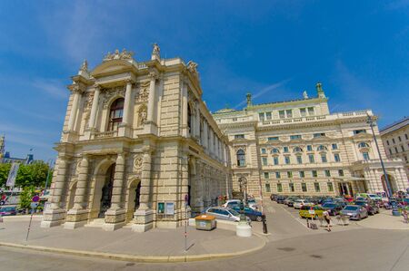 Vienna, Austria - 11 August, 2015: Burgtheater building as seen from street, amazing architecture details, statues decor and incredibly beautiful facade.のeditorial素材