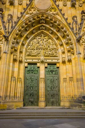 Prague, Czech Republic - 13 August, 2015: Closeup entrance St. Vitus cathedral as seen from front with incredible details and gothic architecture.のeditorial素材