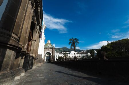 Beautifull view from the center of the place to the presidential palace in Quito, palm and blue skyの写真素材