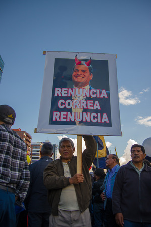 Quito, Ecuador - April 7, 2016: Group of people Holding protest signs, police and journalists during anti government protests in Shyris Avenue.のeditorial素材