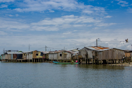Muisne, Ecuador - March 16, 2016: Slums in poor section of the city, in the coast of Ecuador, with...