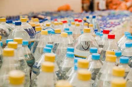 Quito, Ecuador - April 23, 2016: Water donated by citizens of Quito providing disaster relief for earthquake survivors in the coast. Gathered at Bicentenario Park.のeditorial素材