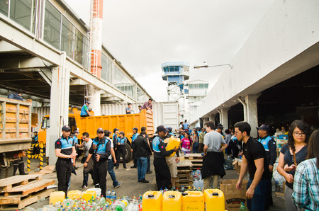 Quito, Ecuador - April 23, 2016: Bags of supplies for disaster relief with food, clothes, medicine and water for earthquake survivors in the coast. Gathered at Bicentenario Park for distribution in Manabi provinceのeditorial素材