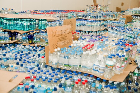 Quito, Ecuador - April 23, 2016: Disaster relief water for earthquake survivors in the coast. Gathered at Bicentenario Park.のeditorial素材