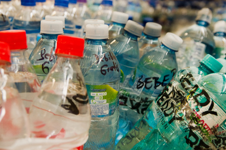 Quito, Ecuador - April 23, 2016: Water donated by citizens of Quito providing disaster relief for earthquake survivors in the coast. Gathered at Bicentenario Park.のeditorial素材