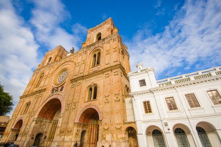Cuenca, Ecuador - April 22, 2015: Spectacular main cathedral located in the heart of city, beautiful brick architecture and facade as seen from street level.のeditorial素材