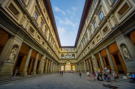 FLORENCE, ITALY - JUNE 12, 2015: Long street surrounded by historic buildings, nice and old architecture in Florence. People walkingのeditorial素材
