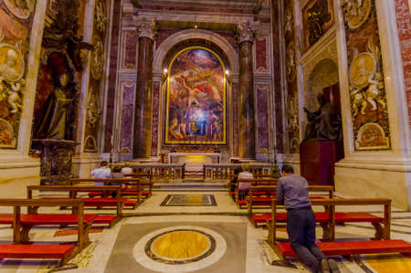 VATICAN, ITALY - JUNE 13, 2015: The tomb of John Paul second inside Vatican basilica, people take the time to pray in front of this spiritual place.のeditorial素材