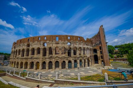 ROME, ITALY - JUNE 13, 2015: Roman Coliseum view in a nice summe day. Building works outside, historic great visit.のeditorial素材