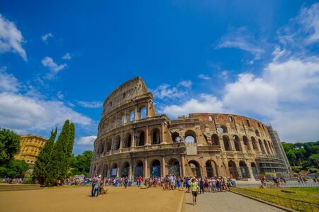 ROME, ITALY - JUNE 13, 2015: Roman coliseum view from outside, turists walking and visiting this iconic structure, summer day.のeditorial素材