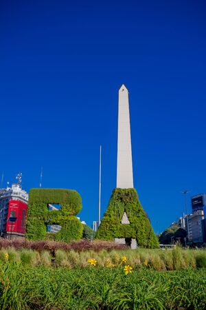 BUENOS AIRES, ARGENTINA - MAY 02, 2016: the initials of the name of the city made of plants in front of the obelisk, iconic building in the city builded in 1936.のeditorial素材