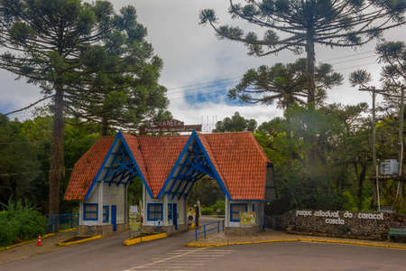 CANELA, BRAZIL - MAY 06, 2016: nice entrance to the park of the city, red roof tiles and white wood walls.のeditorial素材