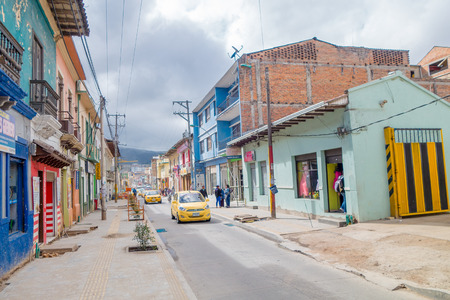 PASTO, COLOMBIA - JULY 3, 2016: some taxis driving trough the street in the city center.のeditorial素材