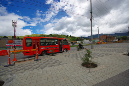 PASTO, COLOMBIA - JULY 3, 2016: public bus with some passenger inside driving trough the city.のeditorial素材