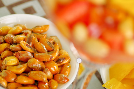 Small white bowl of delicious fried chochos, south american specialty side snack, as seen from...