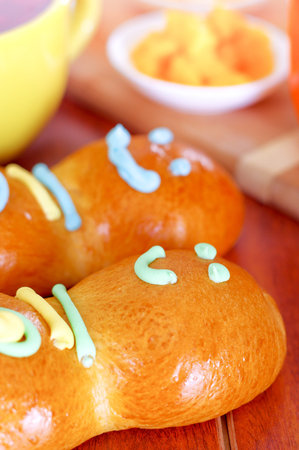 Elegant setup with traditional tasty latin american guagua breads, colorful sugar decorations, day...