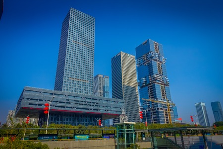 SHENZEN, CHINA - 29 JANUARY, 2017: Inner city streets and sorroundings, beautiful mix of green trees combined with buildings, modern architecture, light traffic, totally blue skiesのeditorial素材