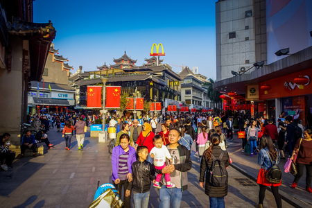 SHENZEN, CHINA - 29 JANUARY, 2017: Lao Gie market district, beautiful mix of traditional chinese and modern architecture, people shopping walking around, great blue skyのeditorial素材