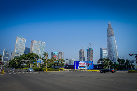 SHENZEN, CHINA - 29 JANUARY, 2017: Nan Shan neighborhood, inner city streets and sorroundings, beautiful mix of green trees combined with buildings, modern architecture, light traffic, totally blue skiesのeditorial素材