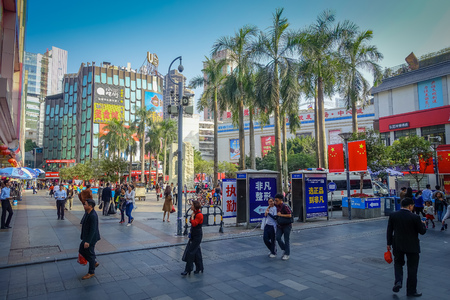 SHENZEN, CHINA - 29 JANUARY, 2017: Inner city streets with sorroundings, beautiful mix of traditional chinese and modern architecture, people shopping walking around, great blue skyのeditorial素材