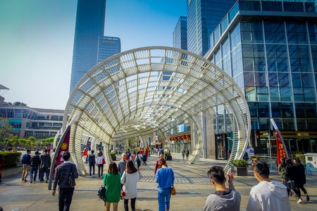 SHENZEN, CHINA - 29 JANUARY, 2017: Inner city streets and sorroundings of Nan Shan neighborhood, spectacular mix of green plants combined with modern buildings architecture, totally blue skiesのeditorial素材