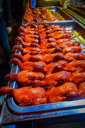 Rows of cooked ducks ready to eat, local chinese food market concept.の写真素材
