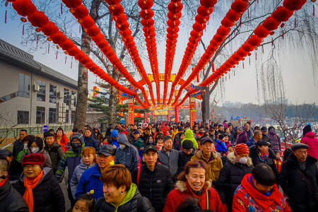 BEIJING, CHINA - 29 JANUARY, 2017: Long lines of people attending the new years fair in Longtan Park, traditional chinese market.のeditorial素材