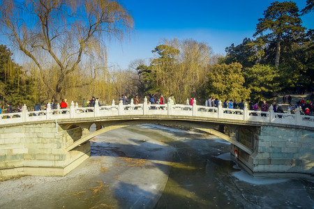BEIJING, CHINA - 29 JANUARY, 2017: Beautiful suspense bridge crossing ricer inside spring palace complex, a spectacular ensemble of lakes, gardens and ancient chinese palacesのeditorial素材