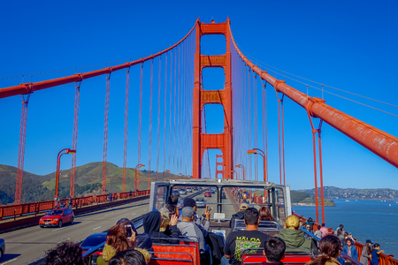 San Francisco, California - February 11, 2017: Beautiful touristic view of Golden Gate Bridge taken from tour bus in San Francisco city.のeditorial素材