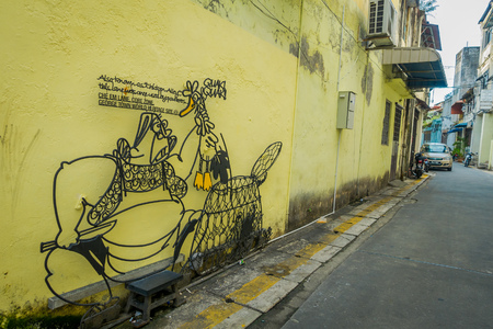 George Town, Malaysia - March 10, 2017: Interesting street art iron sculpture graffiti in Che Em Lane, one of the narrowest streets in George Town city centre.のeditorial素材