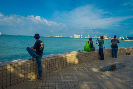 George Town, Malaysia - March 10, 2017:  view of locals fishing  in George Town, second largest city in Malaysia.のeditorial素材
