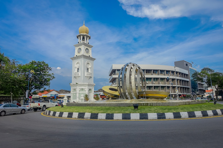George Town, Malaysia - March 10, 2017:  view of Clock Tower and modern water fountain sculpture in the city centre.のeditorial素材